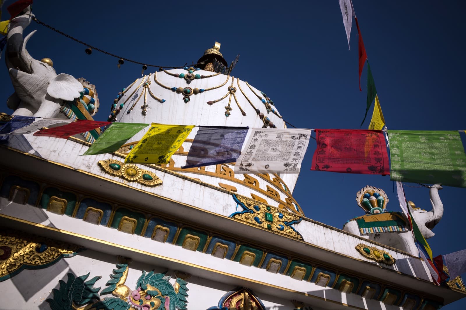 White stupa and Tibetan prayer flags in McLeodganj